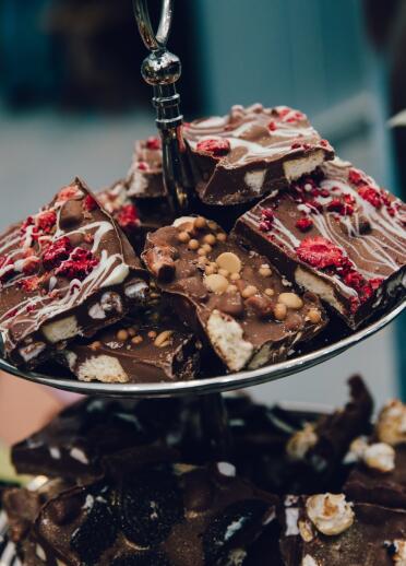 A cake stand filled with shortcake and chocolate tray bakes.